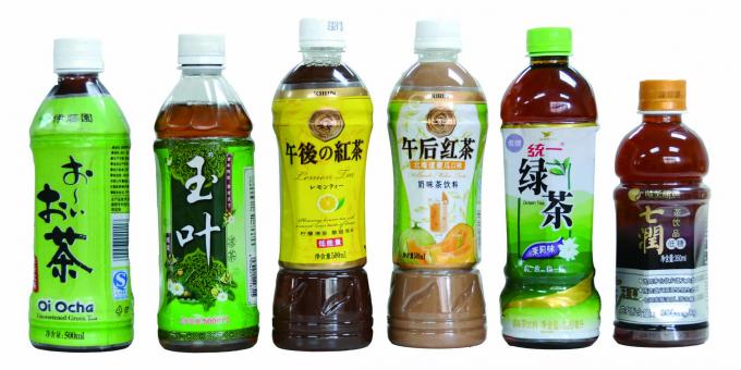 Двосторонній автоматичний аплікатор для наклейки на термоусадочну гільзу для мінеральної води